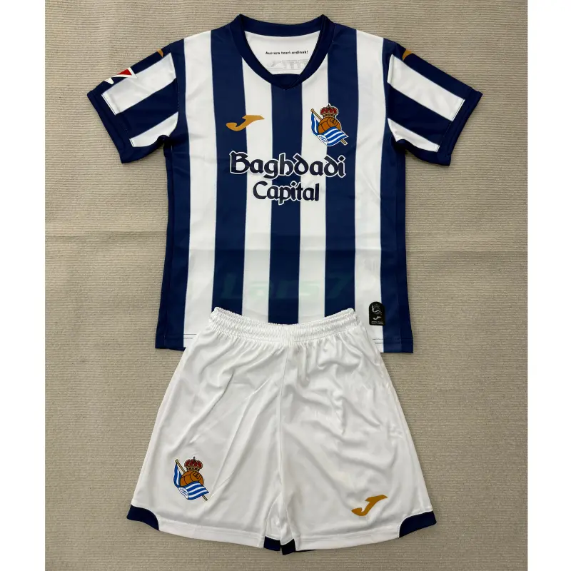Camiseta Real Sociedad 1ª Equipación 2026/2027 Azul/Blanco Niño Kit con Parche La Liga